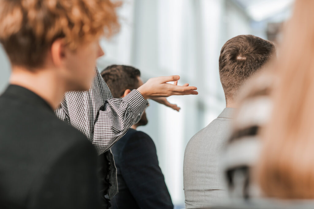 close up. young woman asking about something at a business seminar. 